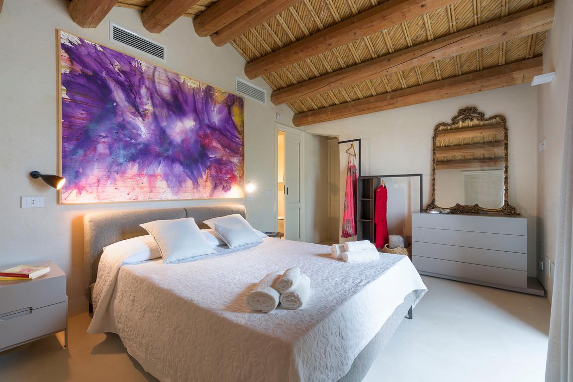 Master bedroom with garden access in Sicily villa